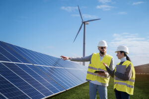medium-shot-engineers-talking-about-solar-pannels