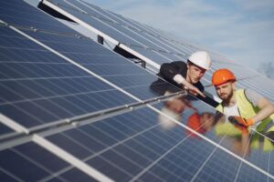 Two man install solar panel